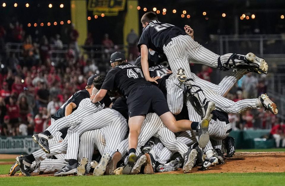 Penn Kingsmen celebrate on the field Saturday, June 17, 2023, during the IHSAA Class 4A baseball state finals at Victory Field in Indianapolis. 
