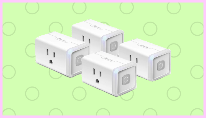 four smart plugs on a green background
