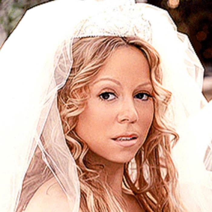 Mariah Carey in her "We Belong Together" music video wearing a bridal veil and wedding dress