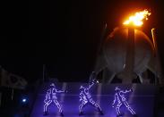 <p>Artists perform during the closing ceremony. REUTERS/Kai Pfaffenbach </p>