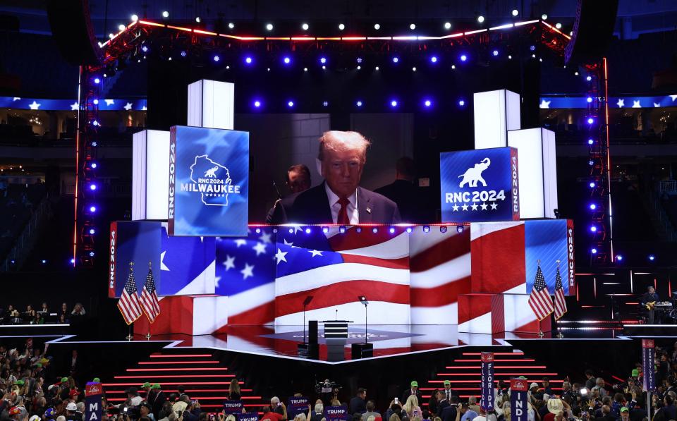 Donald Trump arrives at the RNC with a bandaged ear on Monday night (REUTERS)