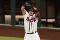 Atlanta Braves' Austin Riley celebrates after a RBI-single against the Los Angeles Dodgers during the sixth inning in Game 4 of a baseball National League Championship Series Thursday, Oct. 15, 2020, in Arlington, Texas. (AP Photo/Tony Gutierrez)