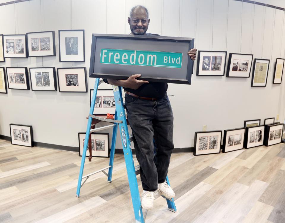 Wayne, NJ -- January 4, 2024 -- Jimmy Richardson with a sign for Freedom Blvd. to replace Auburn St. in Paterson. Richardson is setting up a Martin Luther King Day exhibit, that opens this week at the Wayne Public Library. The exhibition will showcase photos and documents of King.