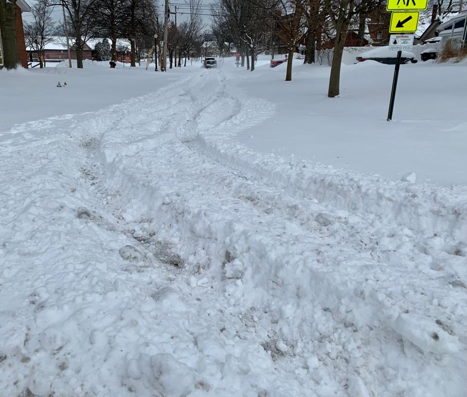 This side street was covered in snow in the late morning on Monday, Jan. 17, 2022, after a major winter storm dumped several inches of snow on Akron the overnight.