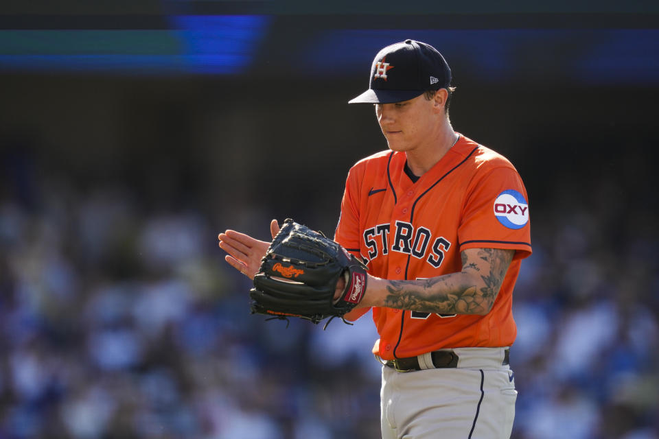 Houston Astros starting pitcher Hunter Brown (58) reacts as he walks to the dugout in the middle of the fourth inning of a baseball game against the Los Angeles Dodgers in Los Angeles, Sunday, June 25, 2023. (AP Photo/Ashley Landis)