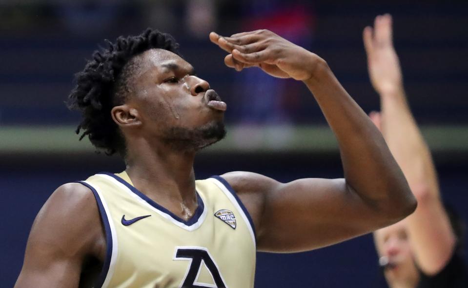 Akron Zips forward Sammy Hunter (11) blows a kiss to the crowd after knocking down a three against the Bradley Braves during the second half of an NCAA college basketball game, Tuesday, Dec. 5, 2023, in Akron, Ohio.