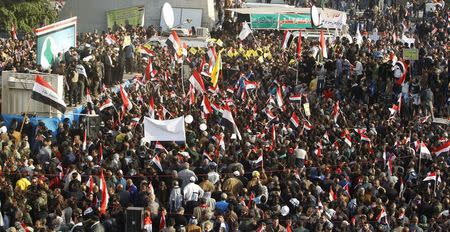 Protesters shout slogans during a demonstration against Turkish military deployment in Iraq, at Tahrir Square in central Baghdad, Iraq, December 12, 2015. REUTERS/Ahmed Saad