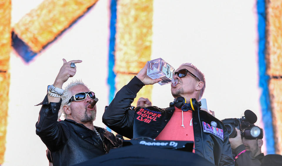 Guy Fieri (L) and Diplo onstage at Guy Fieri's Flavortown Tailgate on February 11, 2024 in Las Vegas, Nevada.