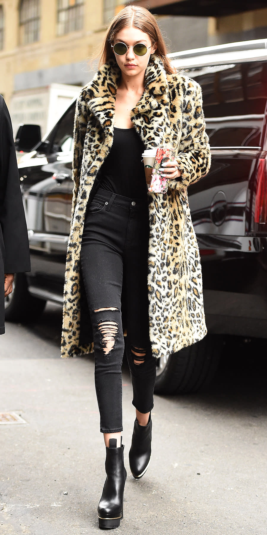 <p>The catwalker made a serious case for leopard when she stepped out in N.Y.C. in a pair of black ripped jeans by <a rel="nofollow noopener" href="http://www.anrdoezrs.net/links/7799179/type/dlg/sid/ISFASHIONGIGISTREETSTYLE/https://www.shopbop.com/ksubi/br/v=1/2534374302148031.htm?gclid=CjwKEAiA8JbEBRCz2szzhqrx7H8SJAC6FjXXhiE0JPGrUe0qKRp0twVALKyfS4-KbIyf5sD7RRBDAhoCB9nw_wcB&all&extid=PS_Google_salenew&cvo_crid=163278124767&cvosrc=ppc.google.ksubi&cvo_campaign=385649188&cvo_crid=163278124767&Matchtype=e&s_kwcid=AL!3510!3!163278124767!e!!g!!ksubi&ef_id=WIZzxAAABYXT-MR@:20170123233645:s" target="_blank" data-ylk="slk:Ksubi;elm:context_link;itc:0;sec:content-canvas" class="link ">Ksubi</a>, a black tank, and a fuzzy leopard-print, mid-length coat by <a rel="nofollow noopener" href="http://www.revolve.com/majorelle-fifi-faux-fur-coat/dp/MALR-WO6/?d=Womens&page=2&lc=3&itrownum=33&itcurrpage=2&itview=01" target="_blank" data-ylk="slk:Majorelle;elm:context_link;itc:0;sec:content-canvas" class="link ">Majorelle</a> (get a similar style from <a rel="nofollow noopener" href="http://www.anrdoezrs.net/links/7799179/type/dlg/sid/ISNewGigiHStreetStyle/http://www.revolve.com/lovers-friends-x-revolve-ava-faux-fur-coat/dp/LOVF-WO83/?d=Womens&page=1&lc=49&itrownum=17&itcurrpage=1&itview=01" target="_blank" data-ylk="slk:Revolve;elm:context_link;itc:0;sec:content-canvas" class="link ">Revolve</a>). She finished off the look with black platform booties and John Lennon-style sunglasses, and of course, a to-go cup from <a rel="nofollow noopener" href="http://click.linksynergy.com/fs-bin/click?id=93xLBvPhAeE&subid=0&offerid=444265.1&type=10&tmpid=9162&RD_PARM1=http%3A%2F%2Fstore.starbucks.com%2F%3Futm_source%3DSBUXcom%2526utm_medium%3DShopMega%2526utm_campaign%3DShopTab%2526utm_content%3DEvergreen%2526cm_mmc%3DSBUXcom-_-ShopMega-_-ShopTab-_-Evergreen&u1=ISNewsGigiHStreetStyle1.23JA" target="_blank" data-ylk="slk:Starbucks;elm:context_link;itc:0;sec:content-canvas" class="link ">Starbucks</a>. We wonder if she's a mocha latte kind of gal, or perhaps someone who enjoys a nice herbal tea ...</p>