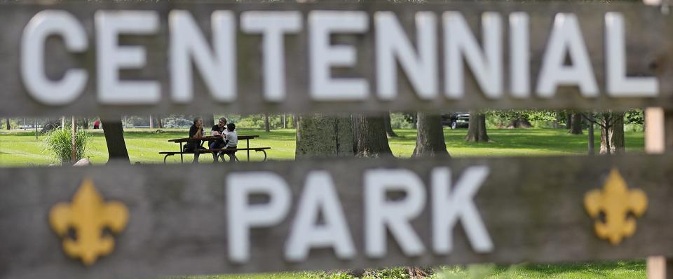 A family enjoys lunch at Centennial Park, Salem’s oldest park, which was created in 1906.