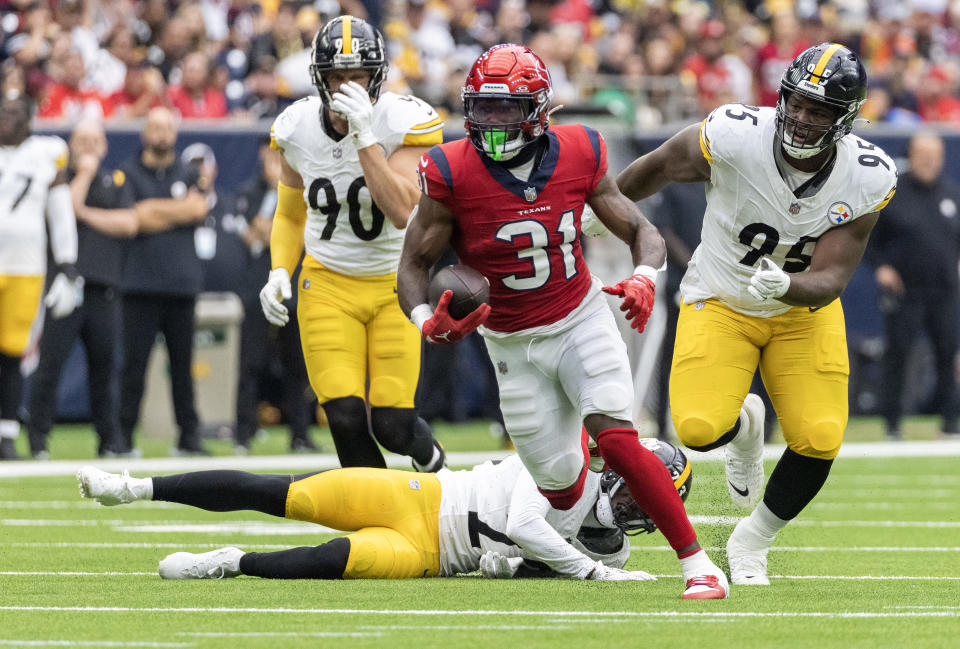 Oct 1, 2023; Houston, Texas, USA; Houston Texans running back <a class="link " href="https://sports.yahoo.com/nfl/players/34063" data-i13n="sec:content-canvas;subsec:anchor_text;elm:context_link" data-ylk="slk:Dameon Pierce;sec:content-canvas;subsec:anchor_text;elm:context_link;itc:0">Dameon Pierce</a> (31) rushes for a first down against the Pittsburgh Steelers in the first quarter at NRG Stadium. Mandatory Credit: Thomas Shea-USA TODAY Sports