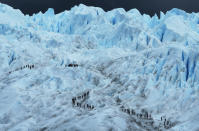 <p>People hike on the Perito Moreno glacier in Los Glaciares National Park, part of the Southern Patagonian Ice Field in Argentina. The majority of the almost 50 large glaciers in Los Glaciares National Park have been retreating during the past fifty years due to warming temperatures. (Mario Tama/Getty Images)</p>