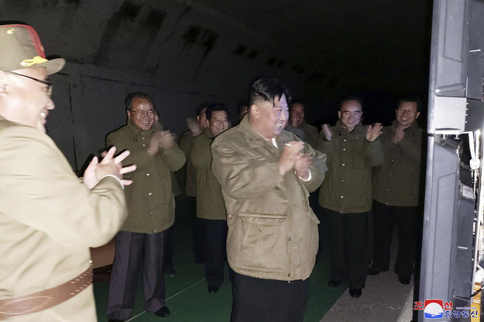 In this photo provided by the North Korean government, North Korean leader Kim Jong Un, center, supervises tests of long-range cruise missiles at an undisclosed location in North Korea Wednesday, Oct. 12, 2022. Independent journalists were not given access to cover the event depicted in this image distributed by the North Korean government. The content of this image is as provided and cannot be independently verified. Korean language watermark on image as provided by source reads: "KCNA" which is the abbreviation for Korean Central News Agency. (Korean Central News Agency/Korea News Service via AP)