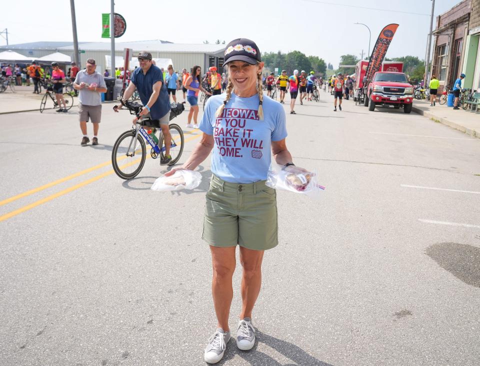 Pie baker and cookbook author Beth Howard outside the Quimby Community Center in Quimby as cyclists roll into town during RAGBRAI on Sunday.