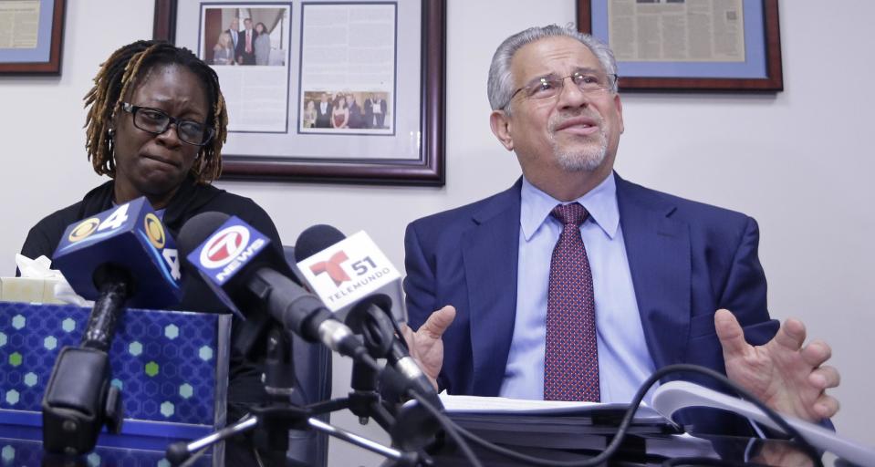Attorney Howard M. Talenfeld, right, talks to reporters as Gina Alexis, left, mother of 14-year-old Nakia Venant, who livestreamed her suicide on Facebook over the weekend, listens, during a news conference, Wednesday, Jan. 25, 2017, in Plantation, Fla. Nakia Venant's suicide is at least the third to be livestreamed nationally in the last month. (AP Photo/Alan Diaz)