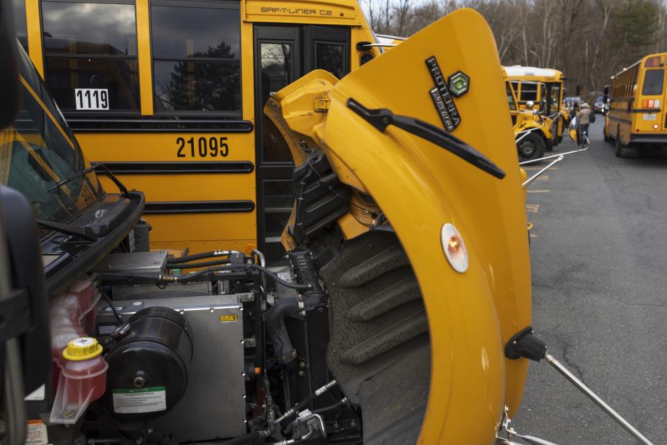 An electric school bus motor is visible inside the Montgomery County Schools bus lot, Friday, Feb. 9, 2024, in Rockville, Md. (AP Photo/Tom Brenner)