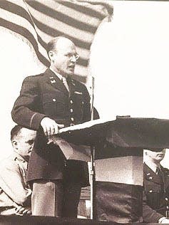 Col. Kenneth D. Nichols, District Engineer of the Manhattan Project, delivers the principal speech at the presentation of Sunday Punch, a B-25 Billy Mitchell bomber, to the AAF, on March 1945.