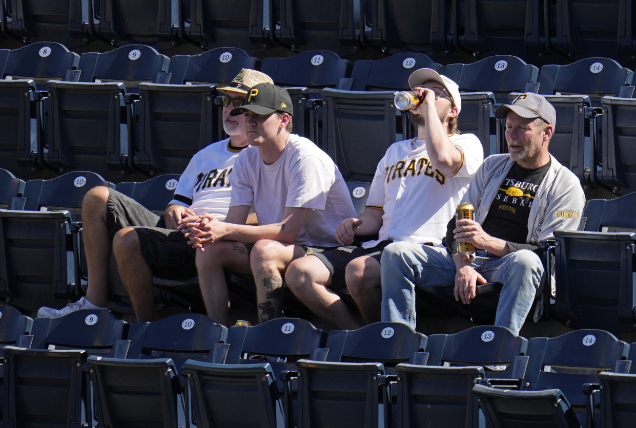 Baseball fans at PNC Park watch a baseball game between the Pittsburgh Pirates and the Houston Astros in Pittsburgh, Wednesday, April 12, 2023. (AP Photo/Gene J. Puskar)