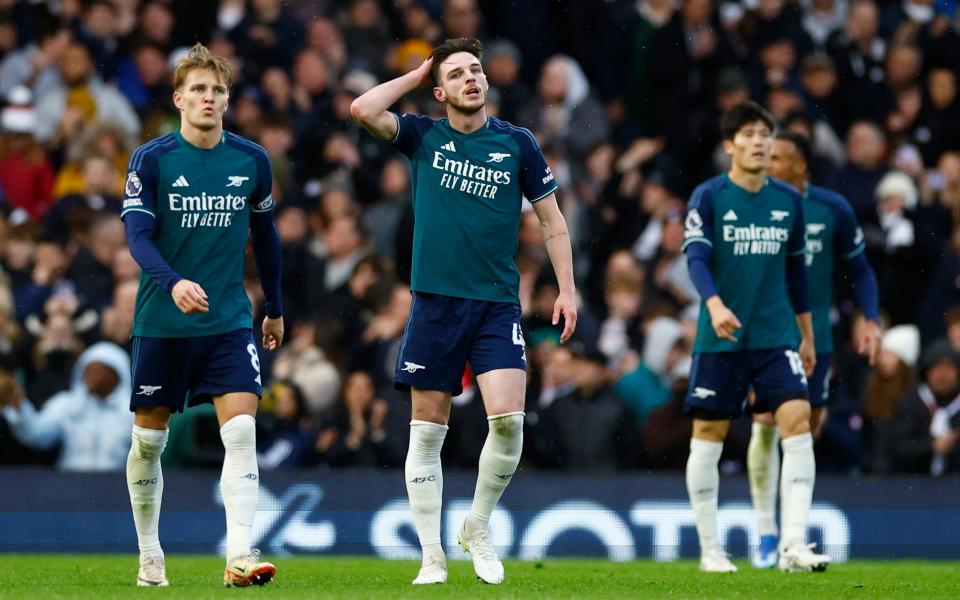 Arsenal's Martin Odegaard and Declan Rice react after Fulham's Bobby Decordova-Reid scored their second goal