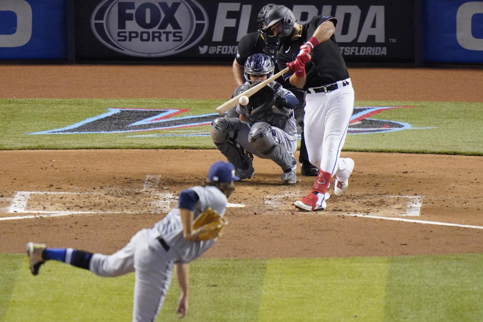 Miami Marlins' Jorge Alfaro hits a foul ball during the fifth inning of the team's baseball game against the Tampa Bay Rays, Saturday, Aug. 29, 2020, in Miami. (AP Photo/Wilfredo Lee)