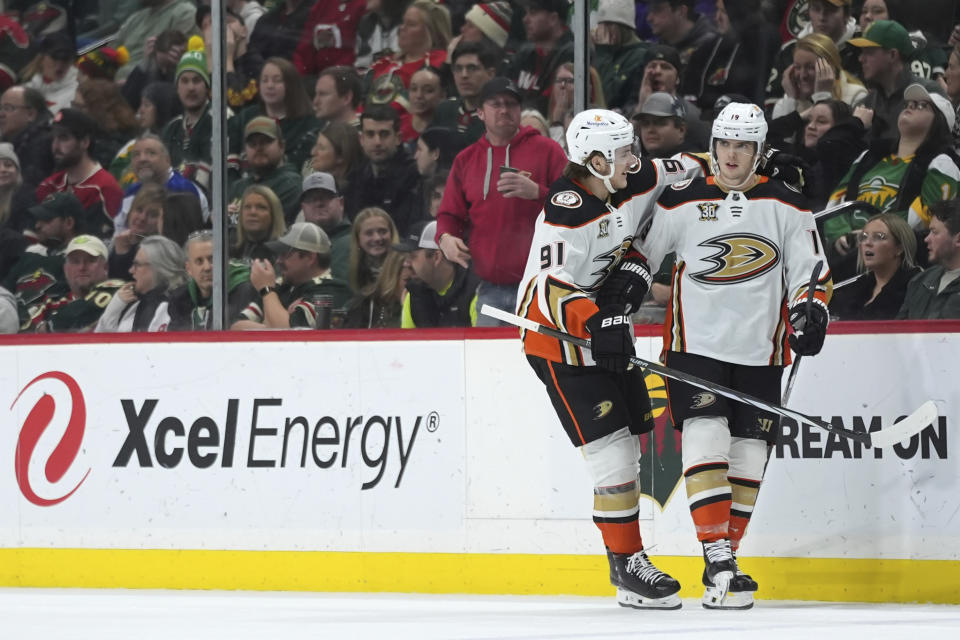 Anaheim Ducks right wing Troy Terry, right, celebrates with center Leo Carlsson (91) after scoring during the third period of an NHL hockey game against the Minnesota Wild, Saturday, Jan. 27, 2024, in St. Paul, Minn. (AP Photo/Abbie Parr)