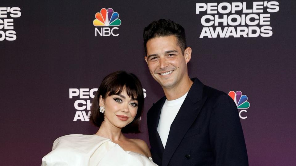 Sarah Hyland and Wells Adams attend the 47th Annual People's Choice Awards at Barker Hangar on December 07, 2021 in Santa Monica, California