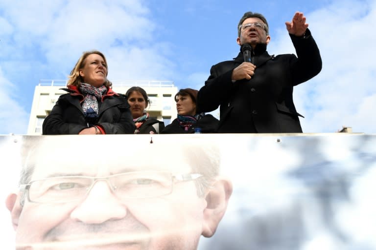 French presidential election candidate for the far-left coalition La France insoumise Jean-Luc Melenchon, speaks next to Left Party's coordinator Dannielle Simonnet aboard an "unbowed" barge on the Canal Saint-Martin on April 17, 2017 in Paris