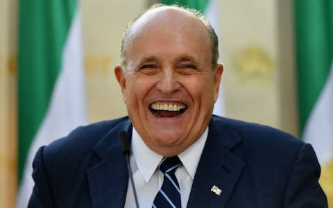 Donald Trump has denied claims he directed his personal lawyer, former New York mayor Rudy Giuliani, pictured, to act on his behalf in trying to get Ukraine to help turn up dirt on his political rivals. - Credit: Angela Weiss/AFP