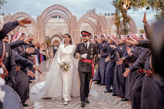 <p>Royal Hashemite Court/Anadolu Agency via Getty</p> Princess Rajwa and Crown Prince Hussein of Jordan on their wedding day on June 1, 2023