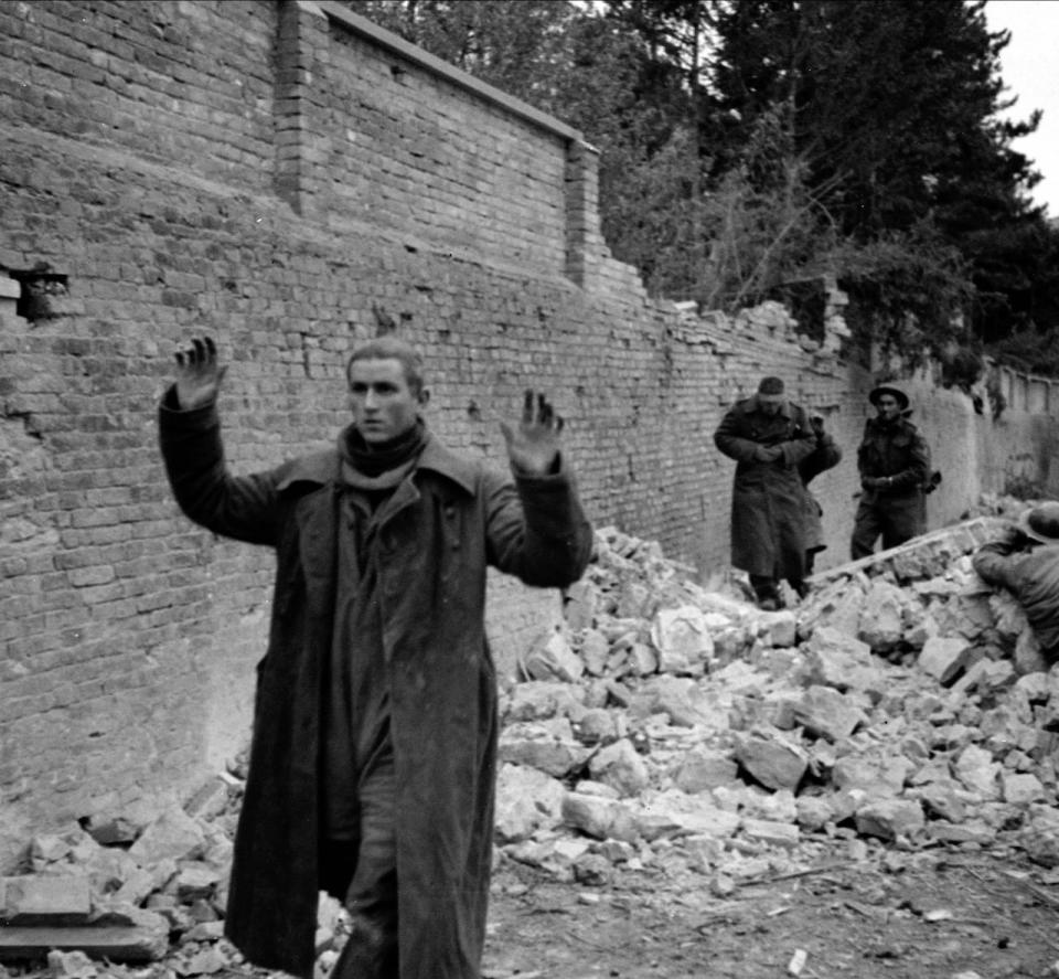 German soldiers surrender to personnel of the Loyal Edmonton Regiment in Ortona, Italy, on Dec. 21, 1943.