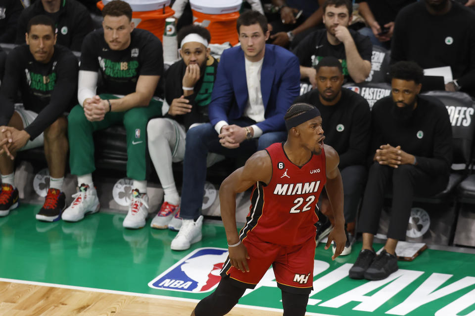 Miami Heat forward Jimmy Butler (22) reacts in front of the Boston Celtics after scoring during the second half of Game 2 of the NBA basketball playoffs Eastern Conference finals in Boston, Friday, May 19, 2023. (AP Photo/Michael Dwyer)