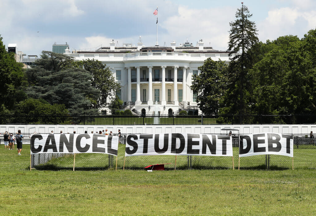 As college students around the country graduate with a massive amount of debt, advocates display a hand-painted sign on the Ellipse in front of The White House to call on President Joe Biden to sign an executive order to cancel student debt on June 15, 2021 in Washington, DC. (Photo by Paul Morigi/Getty Images for We The 45 Million)