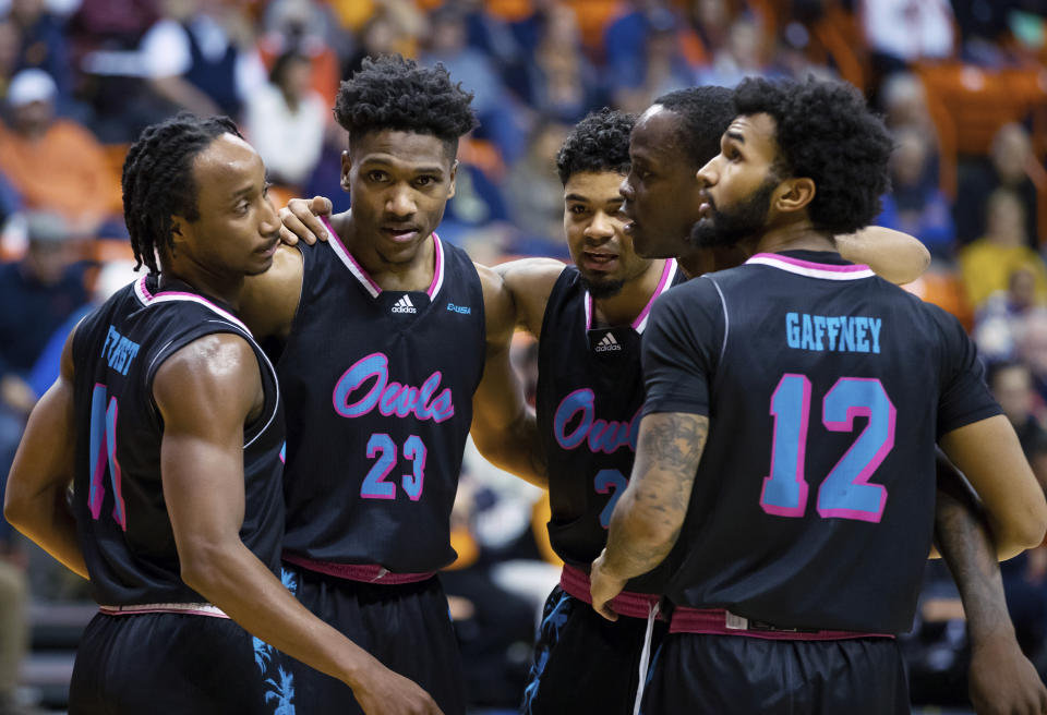 Florida Atlantic's Michael Forrest, Brandon Weatherspoon, Nick Boyd, Johnell Davis and Jalen Gaffney, from left, celebrate at the end of the first half of the team's NCAA college basketball game against UTEP, Saturday, Jan. 21, 2023, in El Paso, Texas. (AP Photo/Andrés Leighton)