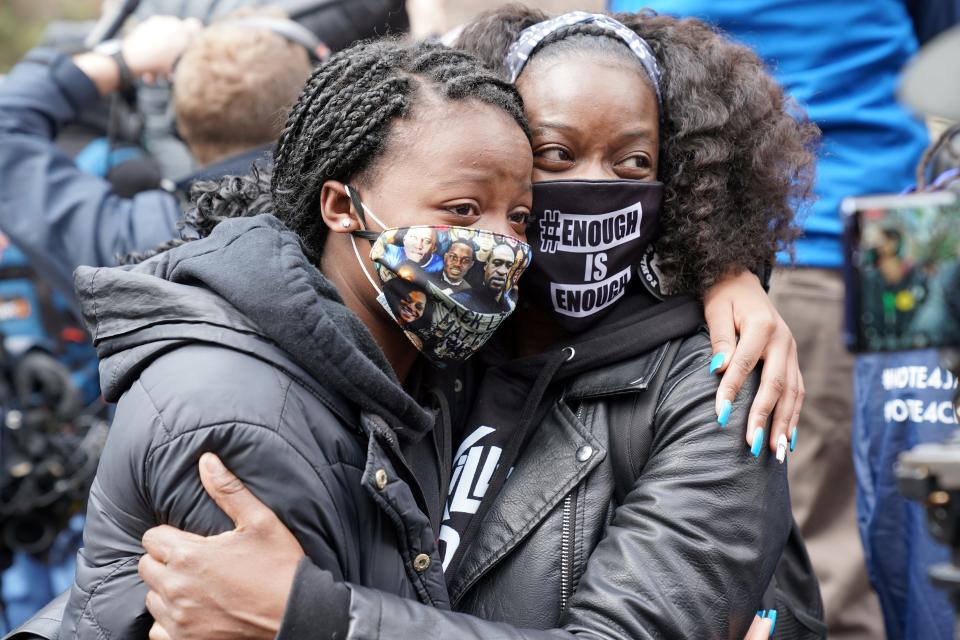 Selena McKnight, 46, hugs her daughter, Jalyn Hall, 18, on Tuesday outside the Hennepin County Government Center in Minneapolis following the conviction of former police officer Derek Chauvin in the death of George Floyd.