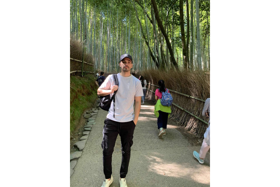 CORRECTS LOCATION TO KYOTO - In this photo provided by Sebastian Bressa, Bressa visits a bamboo grove in Kyoto, during a trip to Japan, on Oct. 2019. More than a year ago Bressa finished his paperwork to become a language teacher in Tokyo and made plans to quit his job in Sydney. His life has been in limbo ever since. Hundreds of thousands of foreigners have been denied entry to study, work or visit families in Japan, which has kept its doors closed to most overseas visitors during the pandemic.(Sebastian Bressa via AP)