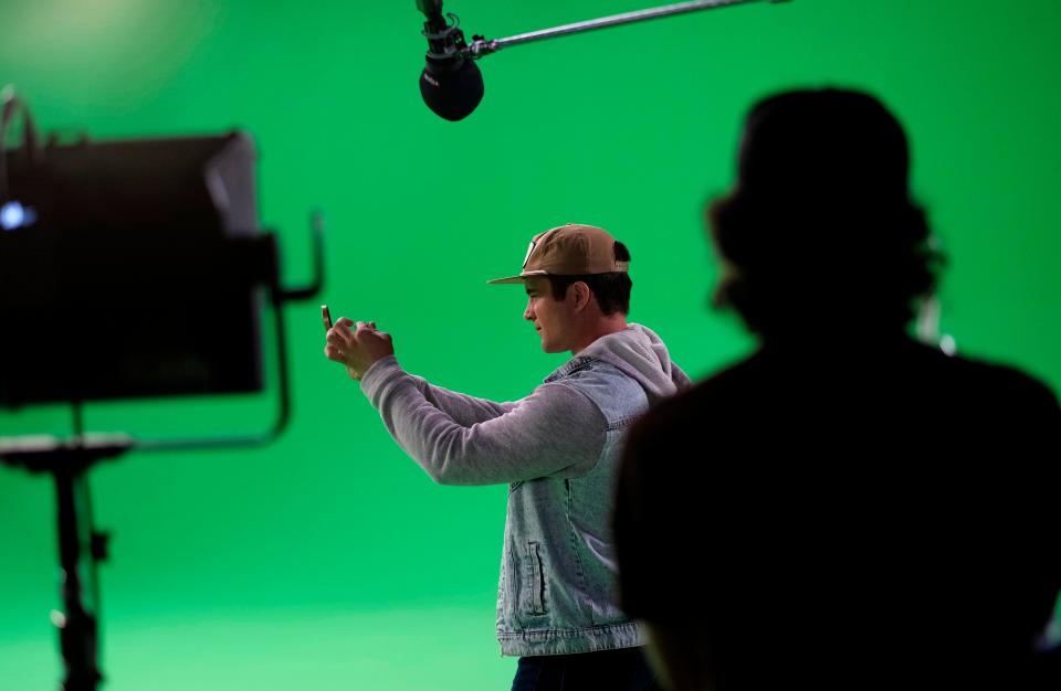 Gattlin Griffith performs against a green screen on Oct. 7, 2022, during the final day of filming for Kyle William Robert's faith-based Oklahoma film "What Rhymes with Reason," a movie on a mission to address teen depression.