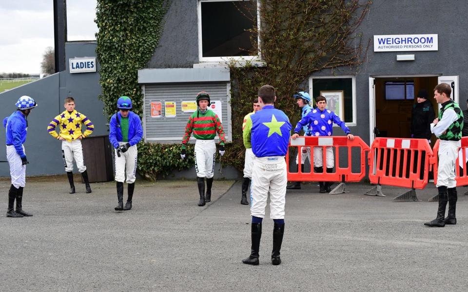 Jockeys keep their distance at Thurles Racecourse in Ireland on Saturday - Get in, race, get out – how horse racing will look behind closed doors - PA