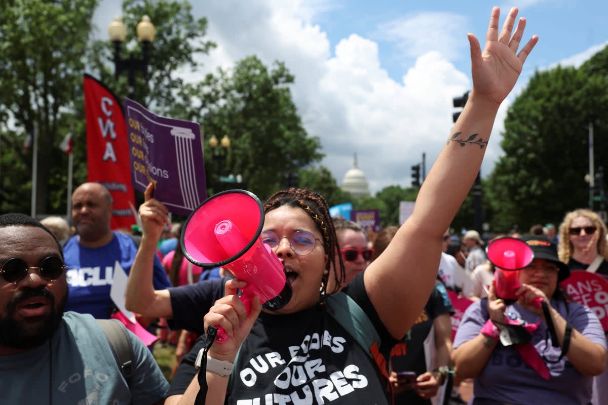 Abortion rights supporters marched to the Supreme Court in Washington DC to mark the one-year anniversary of a decision to overturn Roe v Wade. (REUTERS)