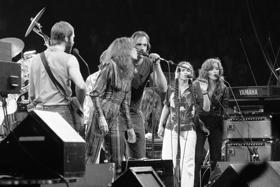 Carly Simon and James Taylor sing at the anti-nuke concert at Madison Square Garden in New York, Sept. 19, 1979. At far right are Larson and Bonnie Raitt. - Credit: Carlos Rene Perez/AP