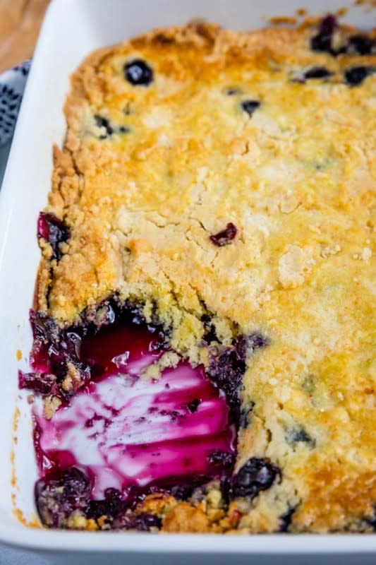 <p>Crazy for Crust</p><p>Make the classic summer dessert even easier by using a cake mix.</p><p><strong>Get the recipe: <a href="https://www.crazyforcrust.com/easy-blueberry-cobbler-recipe/" rel="nofollow noopener" target="_blank" data-ylk="slk:Blueberry Cobbler Dump Cake;elm:context_link;itc:0;sec:content-canvas" class="link ">Blueberry Cobbler Dump Cake</a></strong></p>
