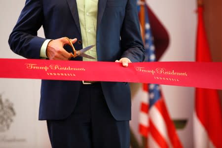 Executive Vice President of The Trump Organization, Donald J. Trump Jr., holds a pair of scissors during pre-launch of the Trump Residences in Jakarta