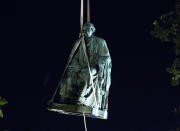 <p>Workers use a crane to lift the monument dedicated to U.S. Supreme Court Chief Justice Roger Brooke Taney after it was was removed from outside Maryland State House, in Annapolis, Md., early Friday, Aug. 18, 2017. Maryland workers hauled several monuments away, days after a white nationalist rally in Charlottesville, Virginia, turned deadly. (Photo: Jose Luis Magana/AP) </p>