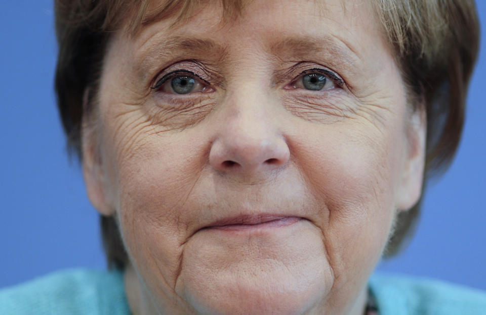 German Chancellor Angela Merkel, smiles as she holds her annual summer news conference in Berlin, Germany, Thursday, July 22, 2021. (Hannibal Hanschke/Pool Photo via AP)