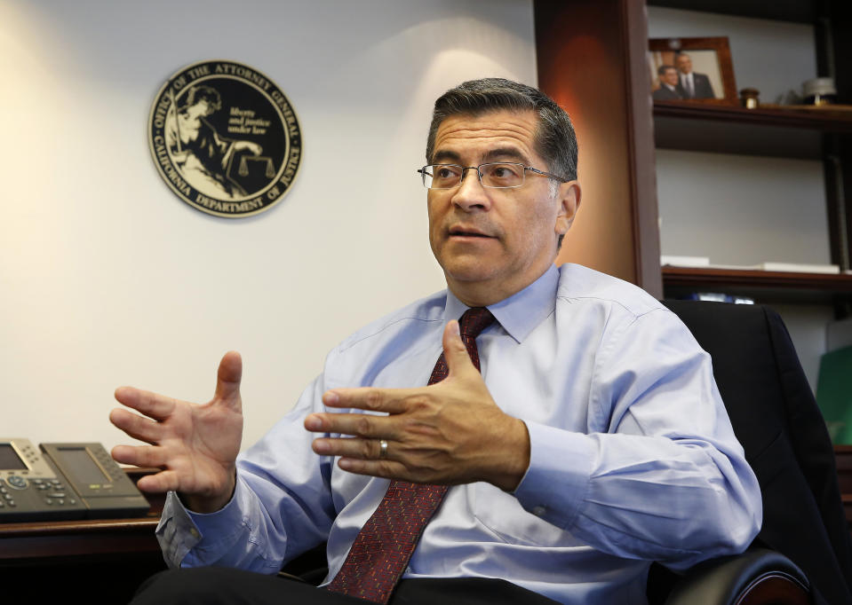 In this photo taken Oct. 10, 2018, California Attorney General Xavier Becerra discusses various issues during an interview with The Associated Press, in Sacramento, Calif. Becerra has used his post atop what some call the “Resistance State” to pummel President Donald Trump’s administration with dozens of legal actions. He may turn up the heat even more, buoyed by his overwhelming endorsement from voters, a Democratic U.S. House and a new, more aggressive governor who takes office Jan. 7. (AP Photo/Rich Pedroncelli)