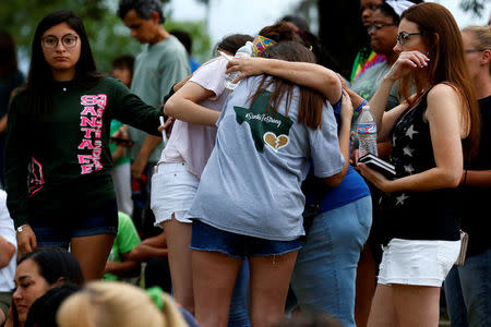 Mourners pray during a vigil in memory of the victims killed in a shooting at Santa Fe High School in League City, Texas, U.S., May 20, 2018. REUTERS/Jonathan Bachman