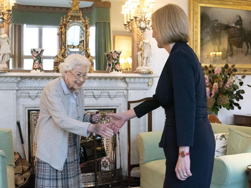 FILE - Britain's Queen Elizabeth II, left, welcomes Liz Truss during an audience at Balmoral, Scotland, where she invited the newly elected leader of the Conservative party to become Prime Minister and form a new government, Tuesday, Sept. 6, 2022. British Prime Minister Liz Truss took office less than two weeks ago, impatient to set her stamp on government. The death of Queen Elizabeth II ripped up Truss’s carefully laid plans for the first weeks of her term, putting everyday politics in the U.K. on hold as the country was plunged into official and emotional mourning.(Jane Barlow/Pool Photo via AP, File)