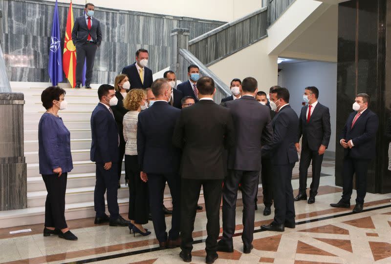 Zaev, leader of the ruling SDSM party, talks with ministers after a group photo with newly elected ministers at the Macedonian parliament in Skopje