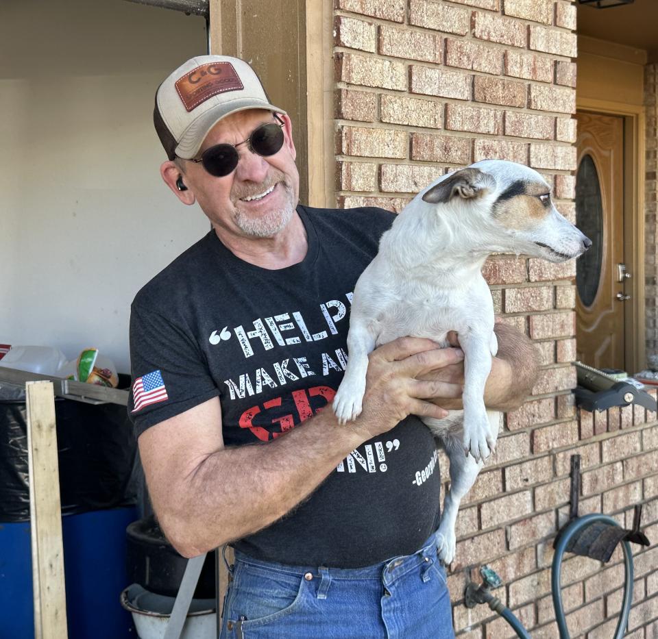 Matthew Baker and his dog Dixie survived the storm that blew through the Panama City Beach area early Tuesday morning. On Wednesday his was out picking up remains.