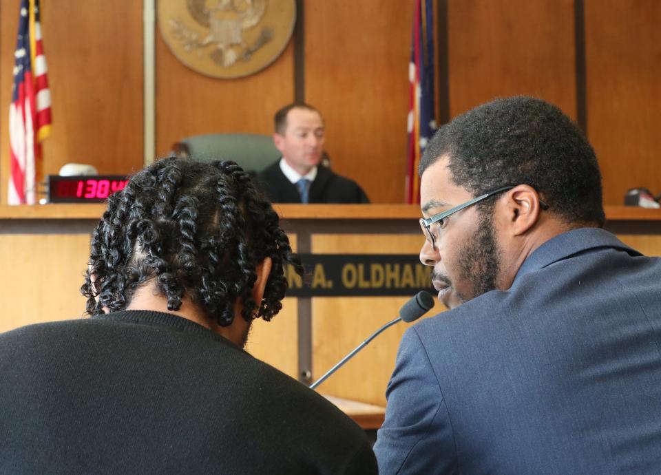 Caleb Mays listens to Shaliek Riggsbee-Powell of the public defender's office at the start of his bench trial June 22 in Akron Municipal Court. Mays was the last person charged the July 2022 protests over Jayland Walker's shooting death to go on trial. Judge Jon Oldham dismissed the charges against Mays.