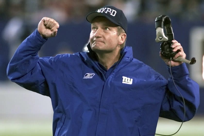 FILE - New York Giants head coach Jim Fassel reacts after referees overturned a ruling on a completed Philadelphia Eagles pass in the fourth quarter at Giants Stadium in East Rutherford, N.J., in this Monday, Oct. 22, 2001, file photo. Fassel, a former coach of the New York Giants who was named NFL coach of the year in 1997 and led the team to the 2001 Super Bowl, has died. He was 71. Fassel's son, John, confirmed the death to the Los Angeles Times on Monday, June 7, 2021. According to the Los Angeles Times, Fassel was taken to a hospital in Las Vegas with chest pains and died of a heart attack. (AP Photo/Jeff Zelevansky, File)